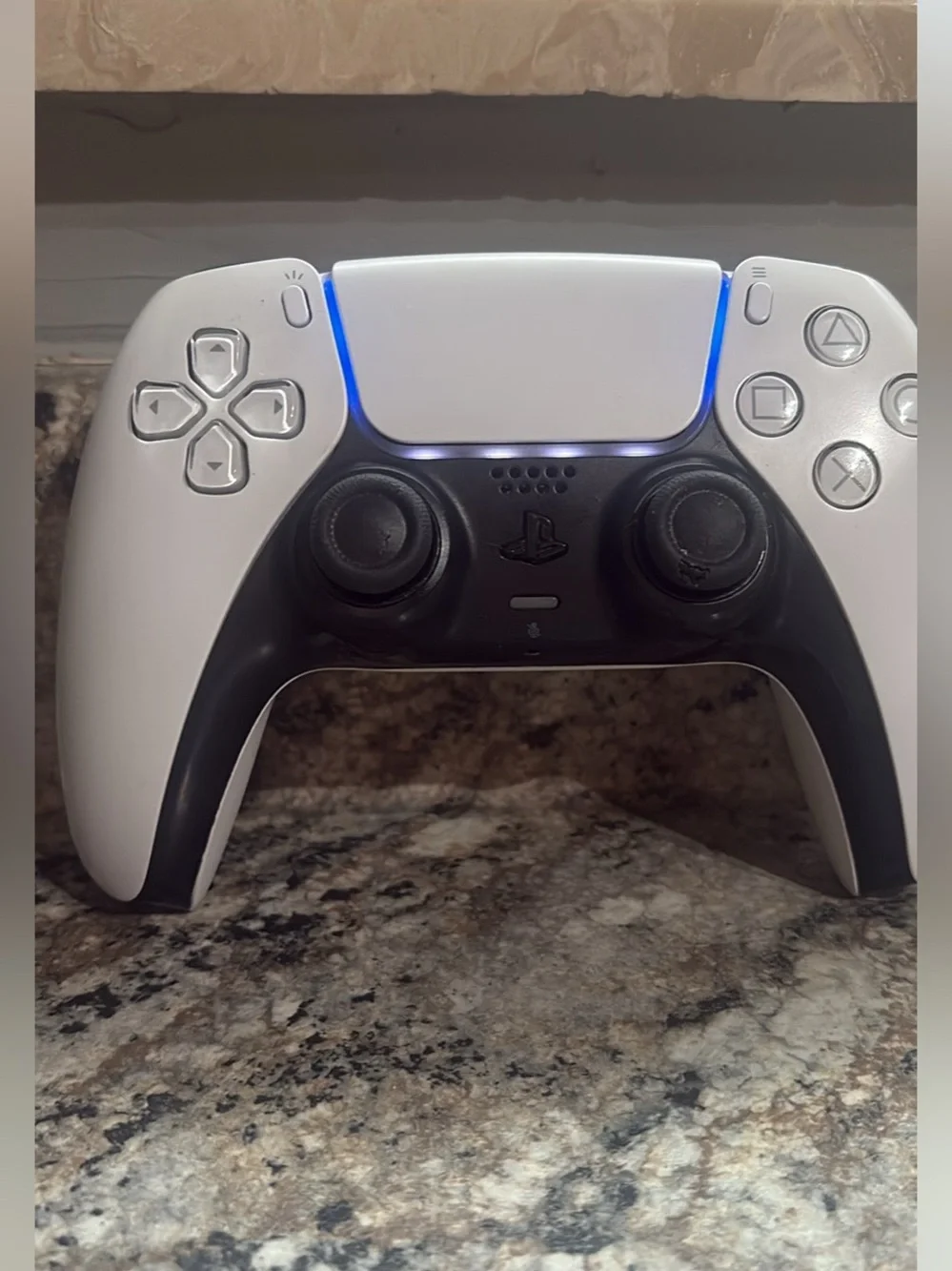 Sony DualSense PS5 Controller — White and Black with Blue Light